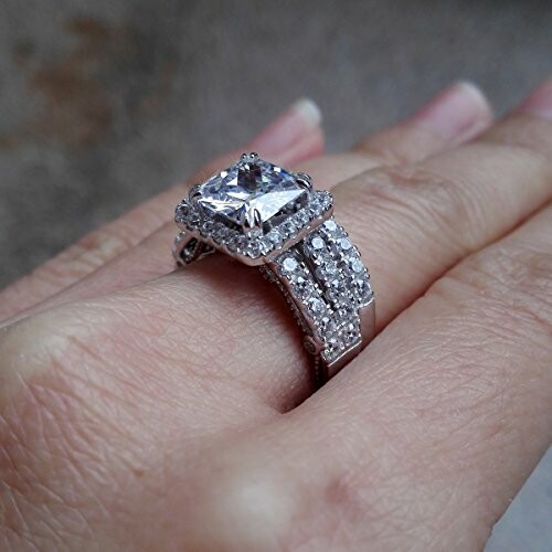 Close-up of a hand wearing a diamond engagement ring