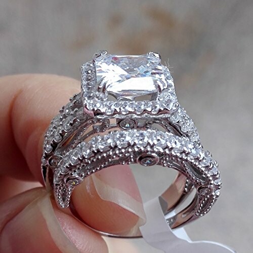 Close-up of a diamond engagement ring with intricate detailing