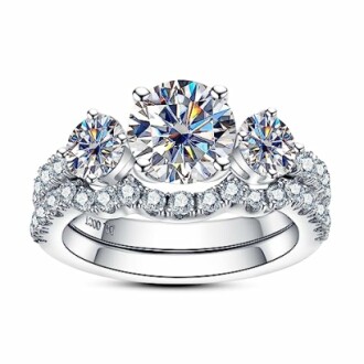 Diamond engagement ring with three stones and a sparkling band.