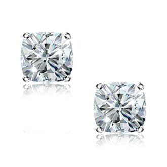 Two diamond stud earrings on white background