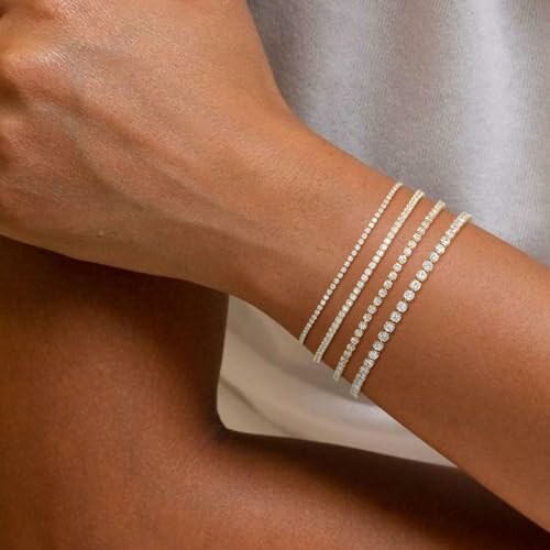 Close-up of a wrist adorned with elegant diamond bracelets.