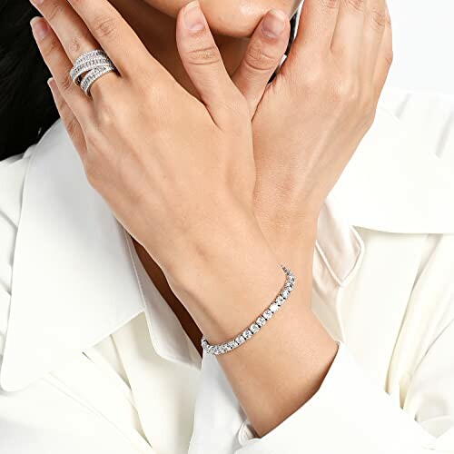 Woman wearing diamond bracelet and rings