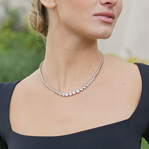 Woman wearing an elegant necklace with a black dress