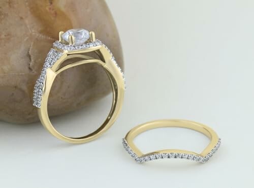 Gold and diamond ring set with a large stone.