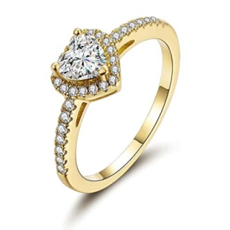 Gold ring with heart-shaped diamond and small stones.