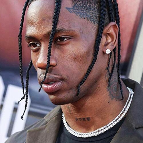 Man with braided hair and necklace