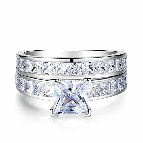 Silver ring with a princess cut diamond and channel set stones