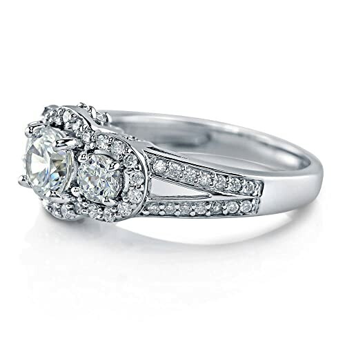 Silver engagement ring with two large diamonds and smaller accent stones.