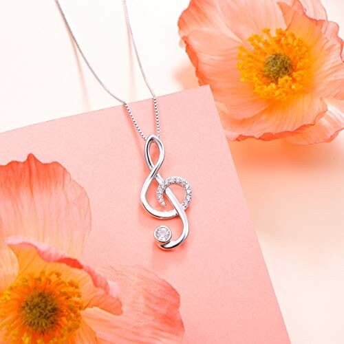 Silver treble clef necklace with pink flowers