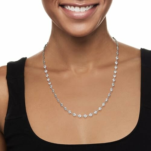 Smiling woman wearing a diamond necklace