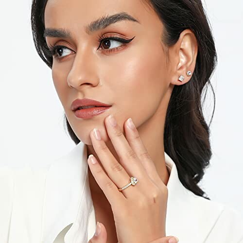 Woman with earrings and a ring.