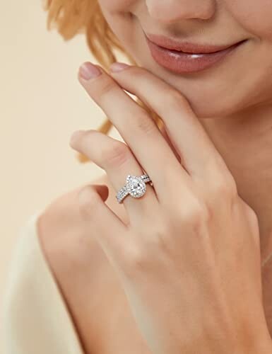 Woman's hand with diamond ring on finger